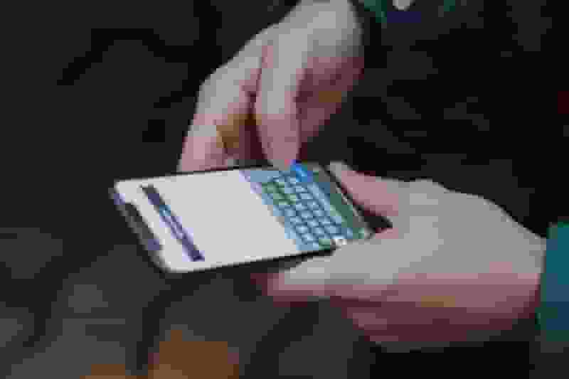 man holding a smartphone min