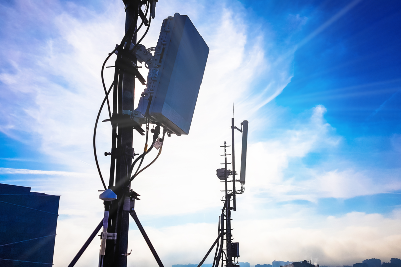 silhouette of 5G smart cellular network antenna base station on the telecommunication mast